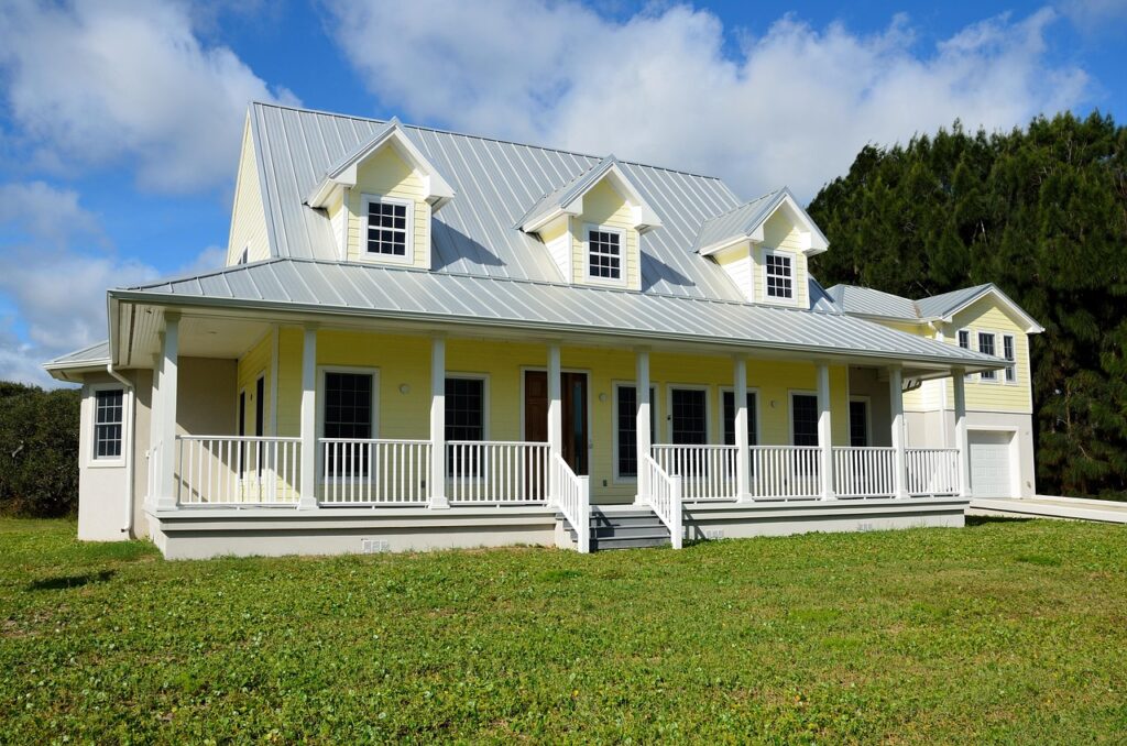 New residential home exterior with lawn, showcasing neighborhood architecture and construction.